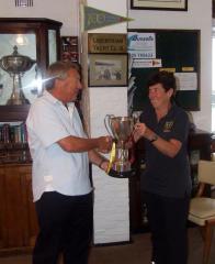 Commodore of Parkstone, Dick Linford, presents Kathy with the Bussell Cup