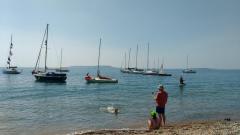 Club boats at anchor off Ringstead beach