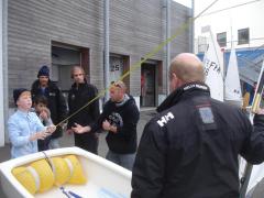 Adrien sets his boat up with Dad's help watched by David Lanier