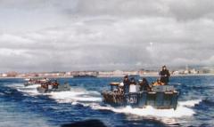 Landing craft ferrying troops to transports off Weymouth