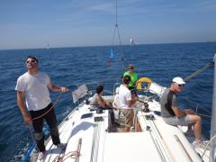 The crew of Gwaihir Venturi relax after winning their class in the Tour des Ports