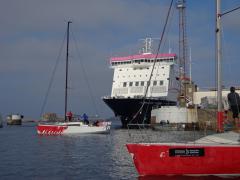 The Sunfast 3600 from Granville and the ferry at the entrance to St Helier