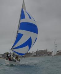 Snow Goose under spinnaker heads away from P mark, followed by Echo