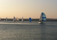 ' Melody' leads the fleet downwind as the breeze begins to fill in