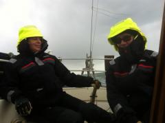 Mark and Rima model their new jackets in a squall