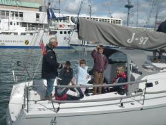 The Bugler family salute the Commodore