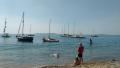 Club boats at anchor off Ringstead beach